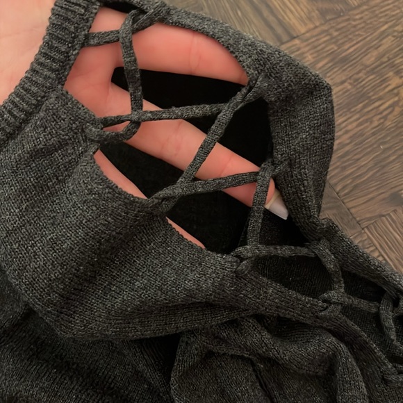 Grey sweater with both arms having a cutout design. - Picture 2 of 3